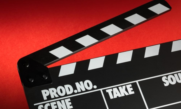 film-slate-against-red-background